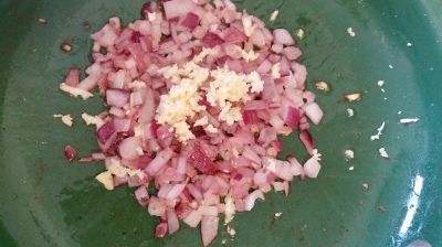 half cup diced onion plus minced garlic in pan
